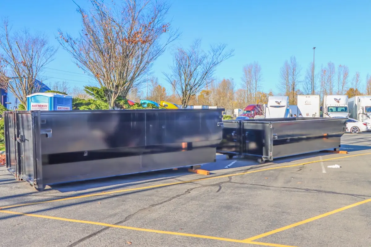 Professional dumpster rental service with roll-off container on residential driveway in Camp Verde